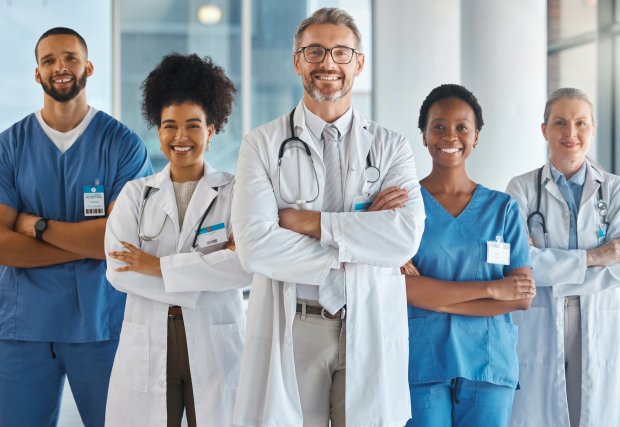 stock image of medical professionals all standing together and smiling