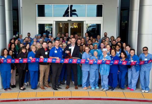 People cutting a ribbon to open West Henderson Hospital