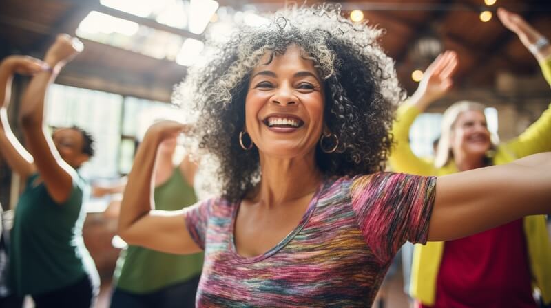 Happy woman moving in dance class.